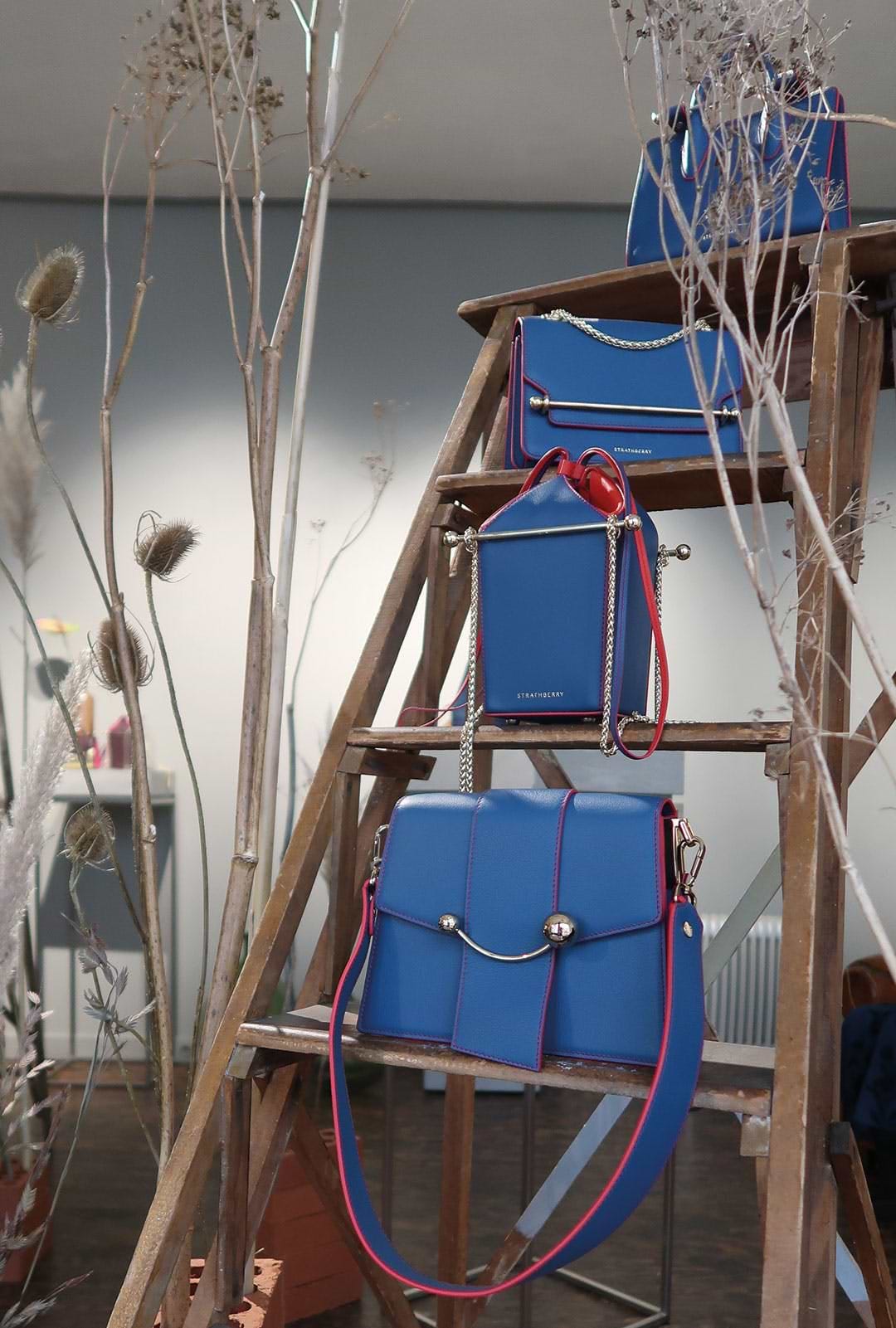 A ladder that has a bunch of bags on it