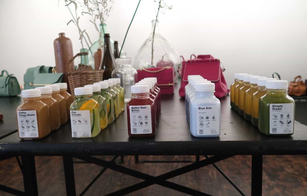 A table topped with lots of bottles of liquid