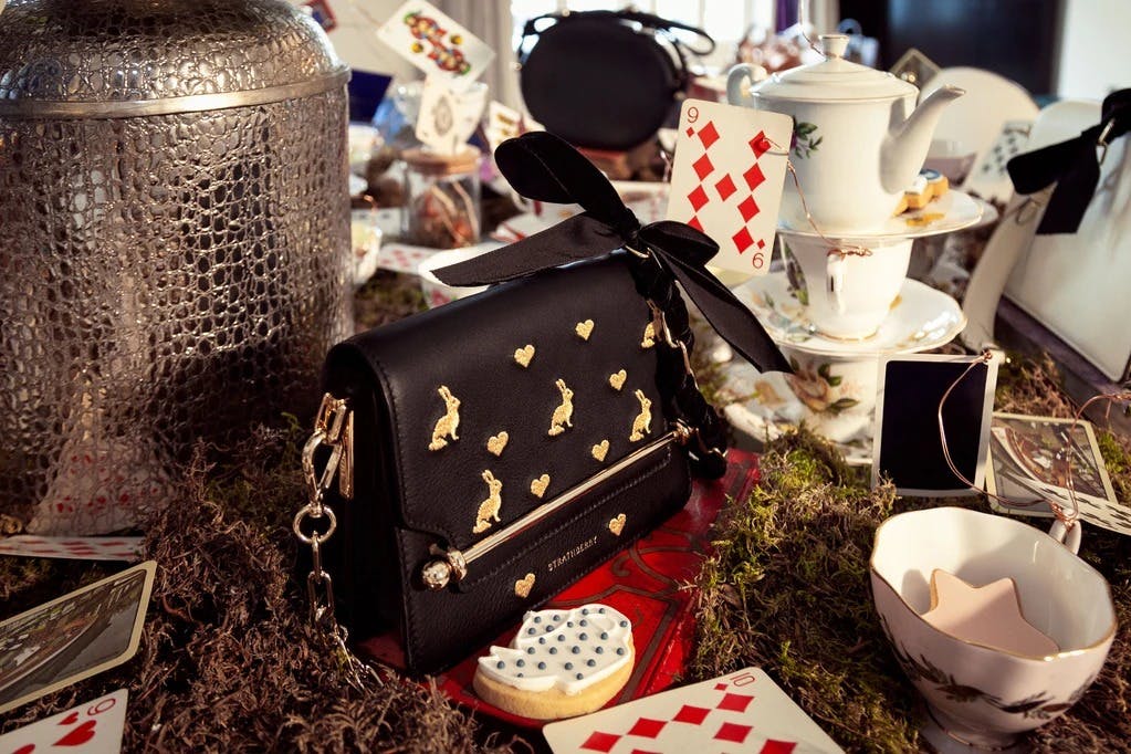 A table topped with lots of cards and a purse
