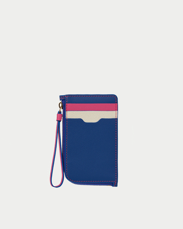 A small blue wallet with a pink and white stripe