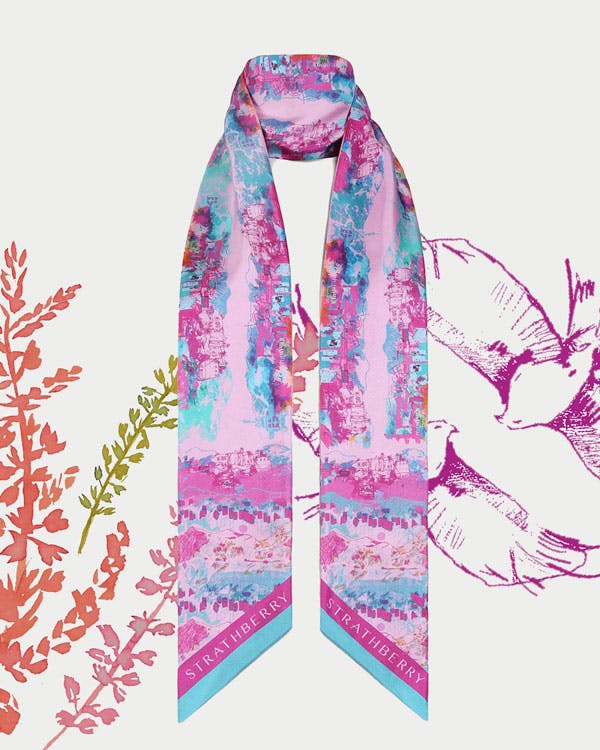 A pink and blue scarf with birds and flowers