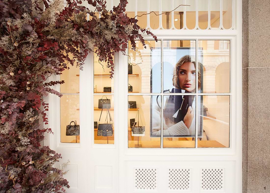 A woman is looking out of a window