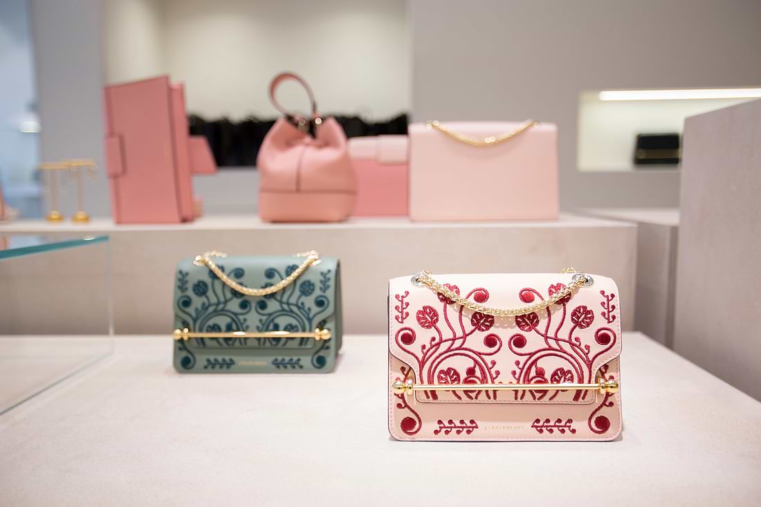 A display of handbags and purses in a store