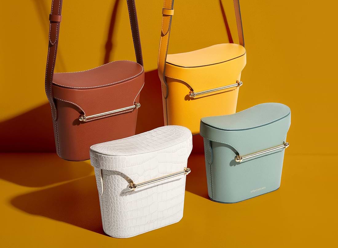 Three different colored buckets sitting next to each other