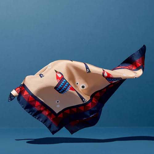 A sculpture of a fish is flying through the air