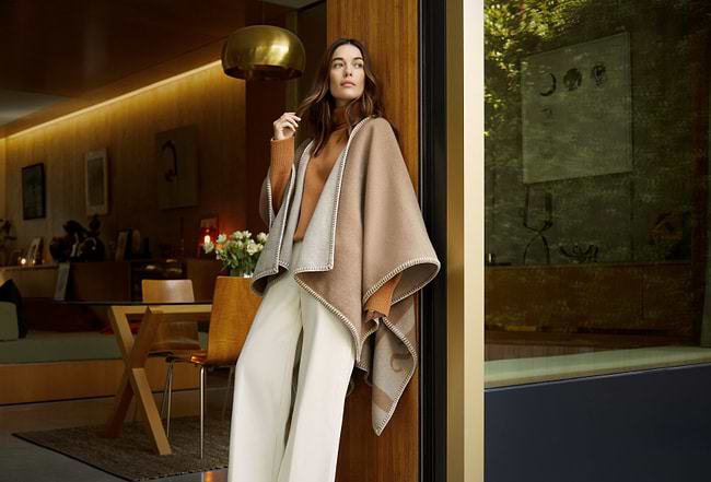 A woman standing in front of a door