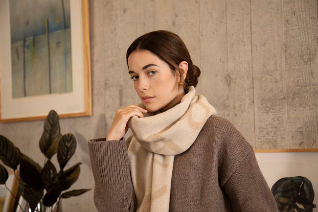 A woman with a scarf around her neck