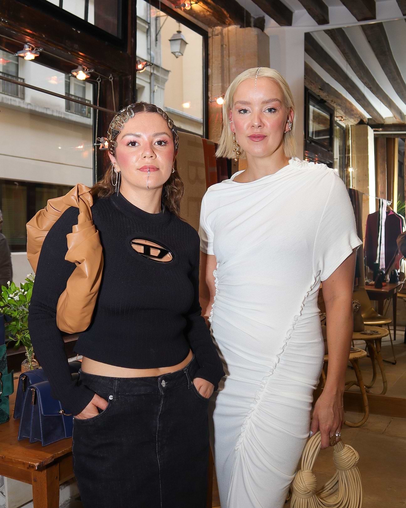 Two women standing next to each other in a room
