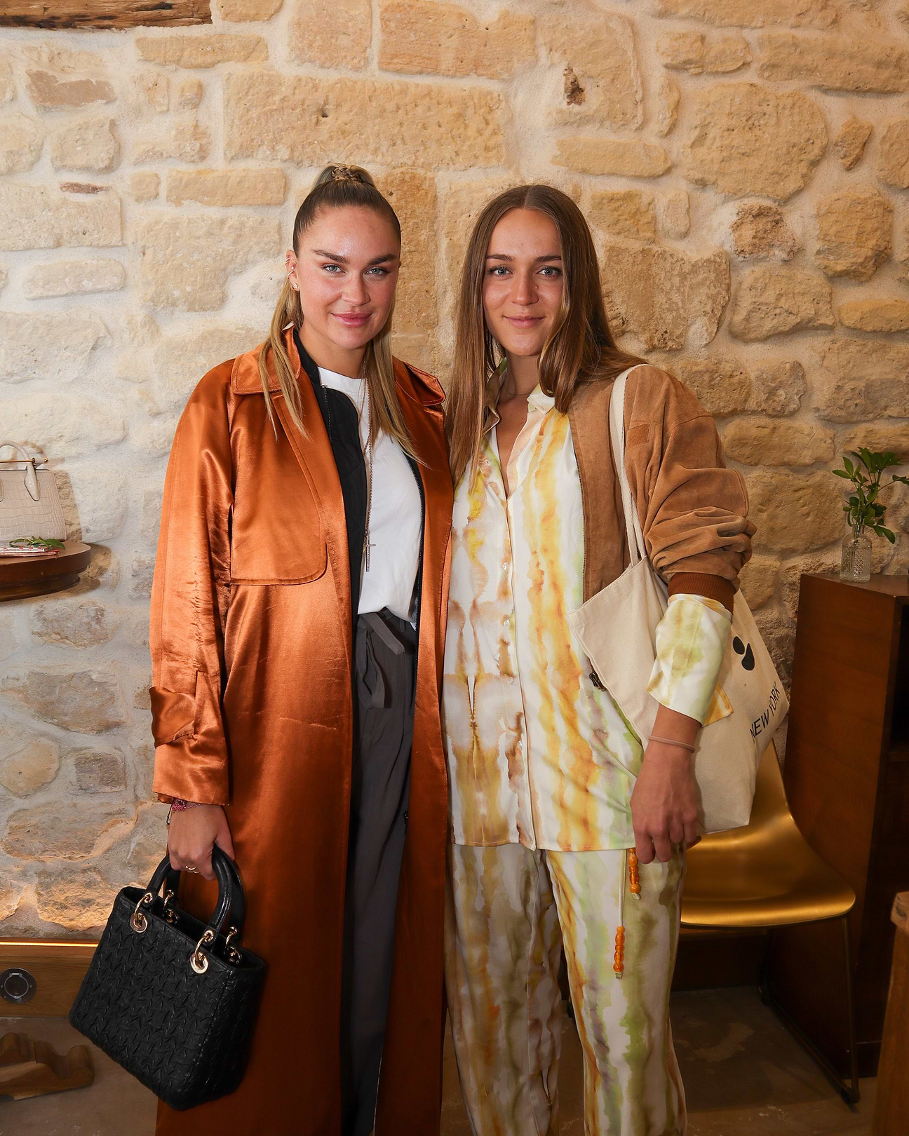 A couple of women standing next to each other