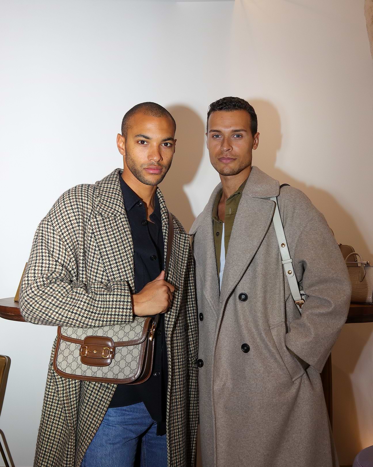 A couple of men standing next to each other
