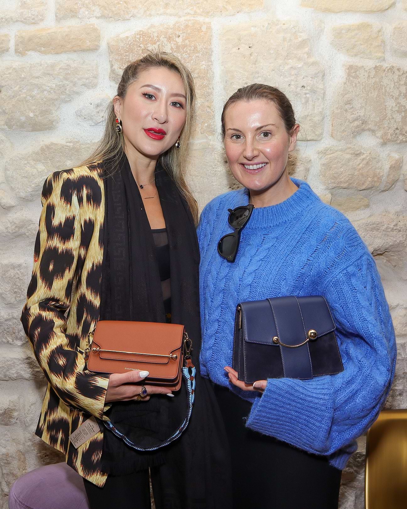 A couple of women standing next to each other
