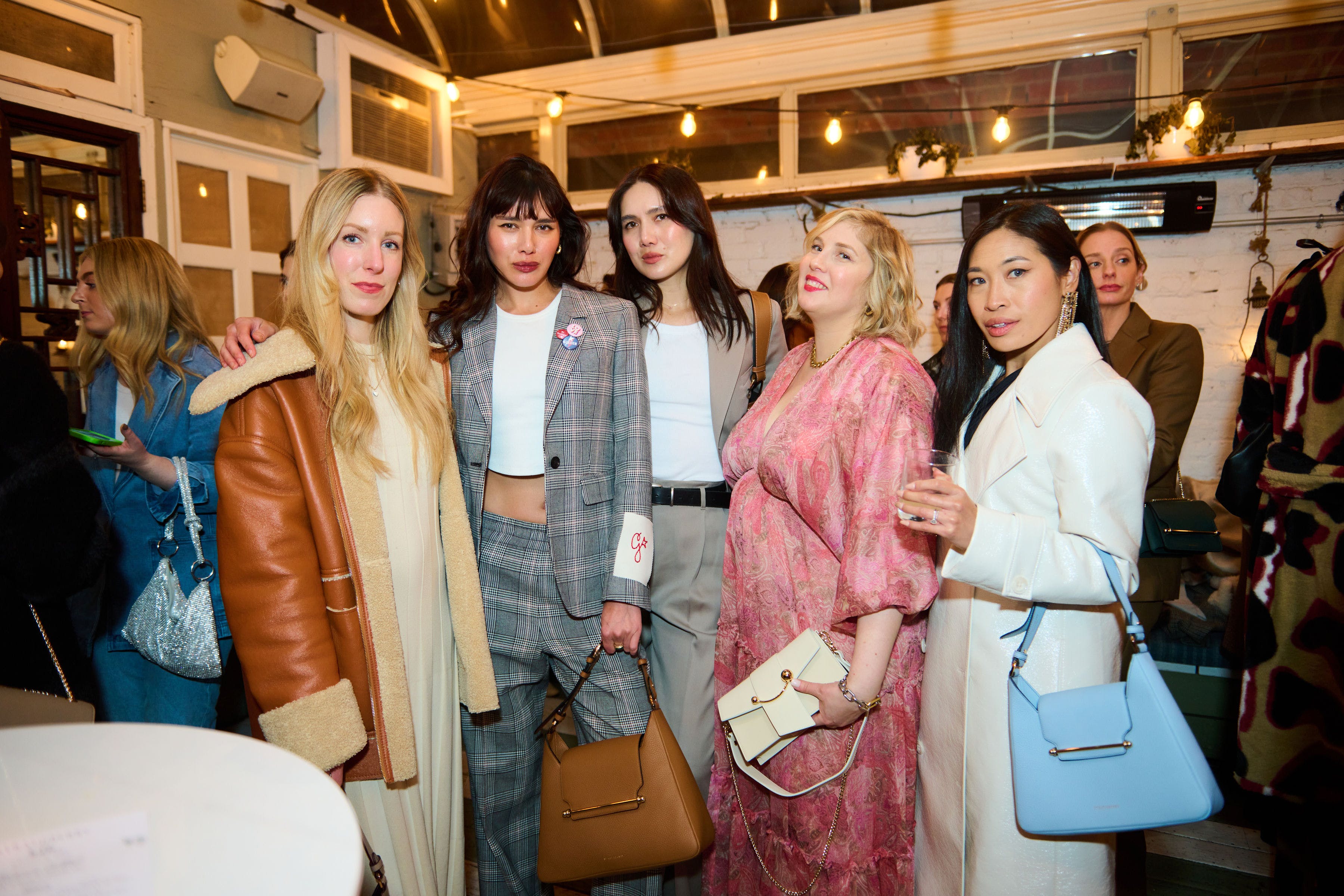 A group of women standing next to each other