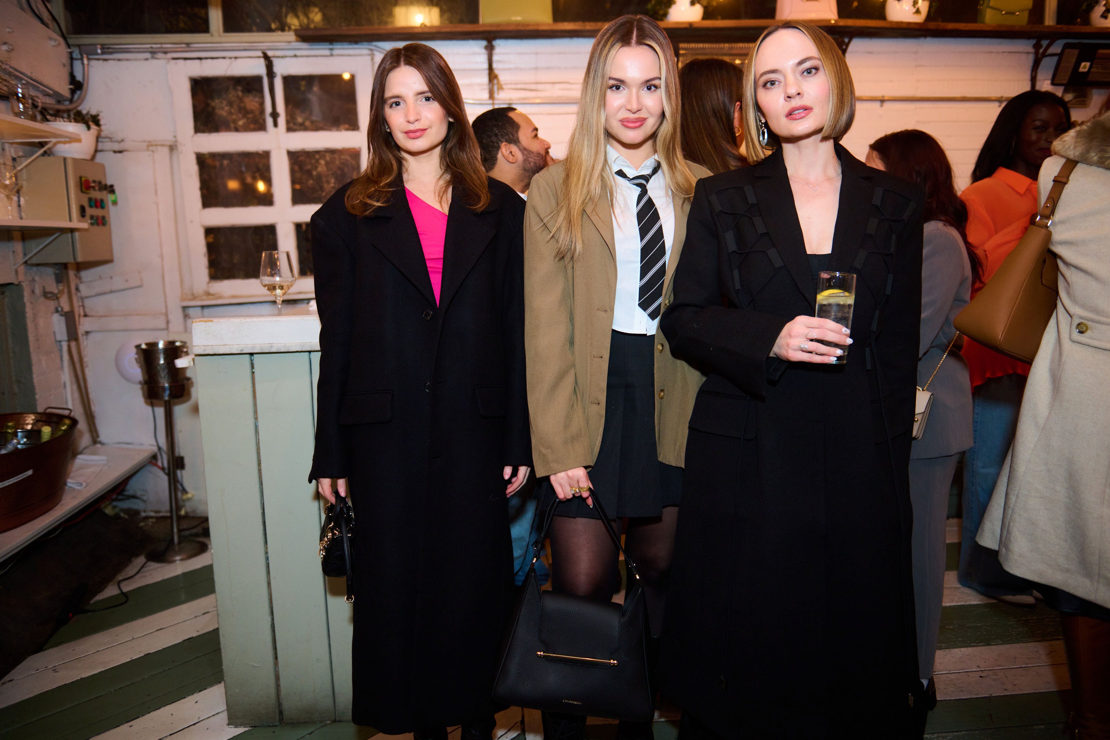 A group of women standing next to each other