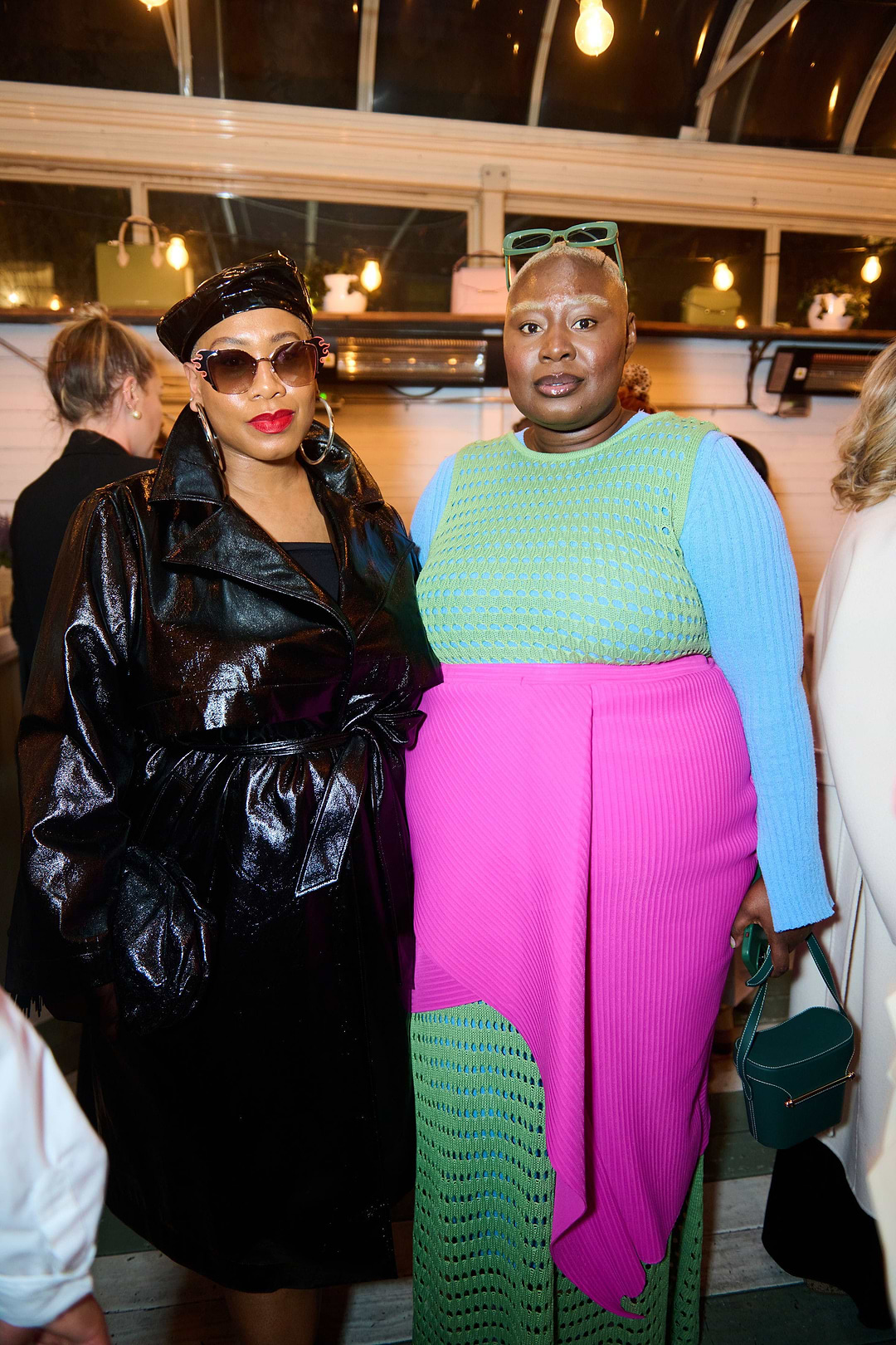A couple of women standing next to each other