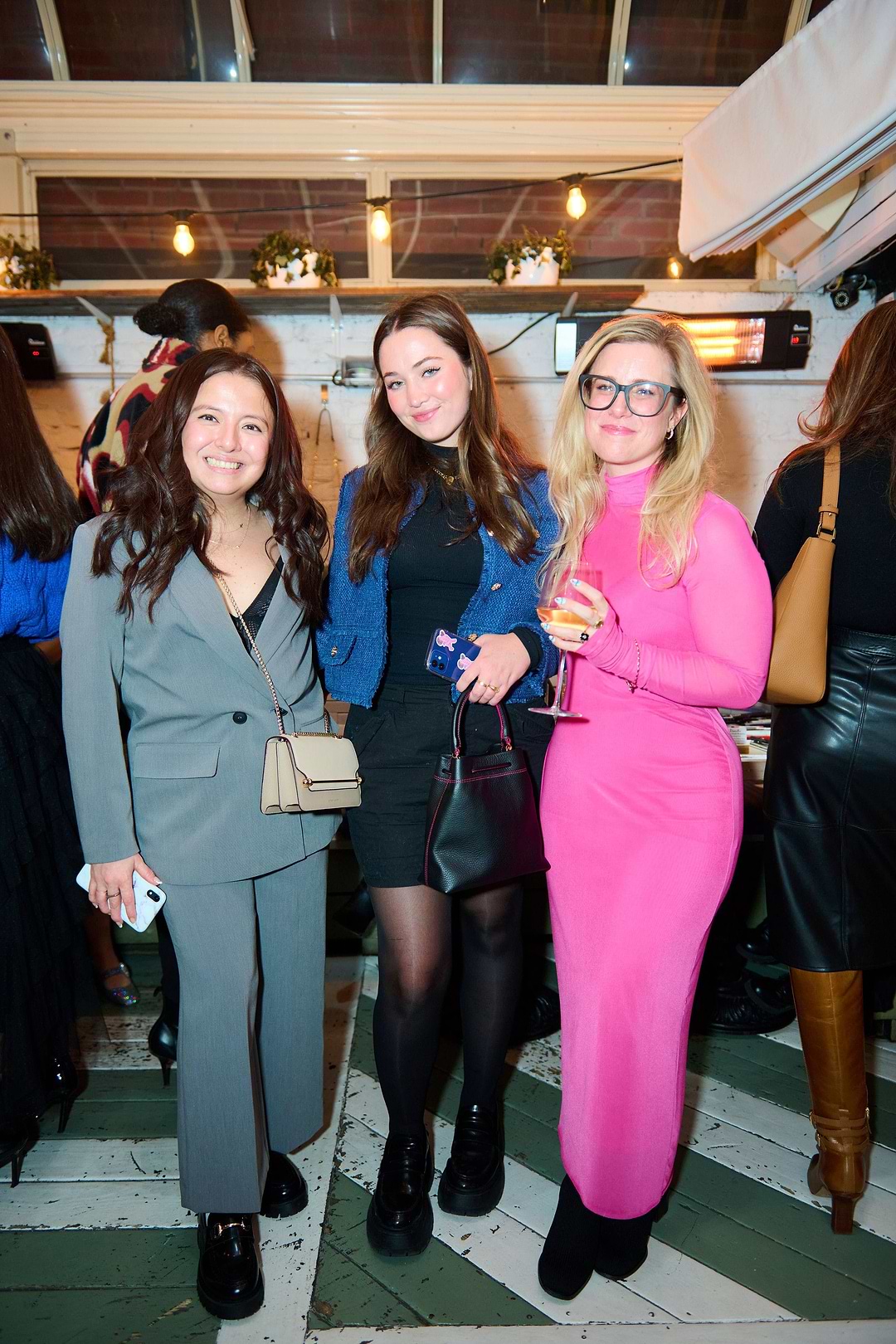 A group of women standing next to each other
