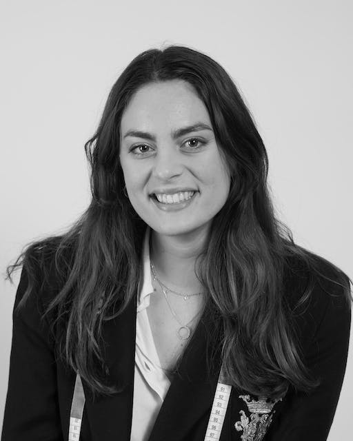 A black and white photo of a woman smiling