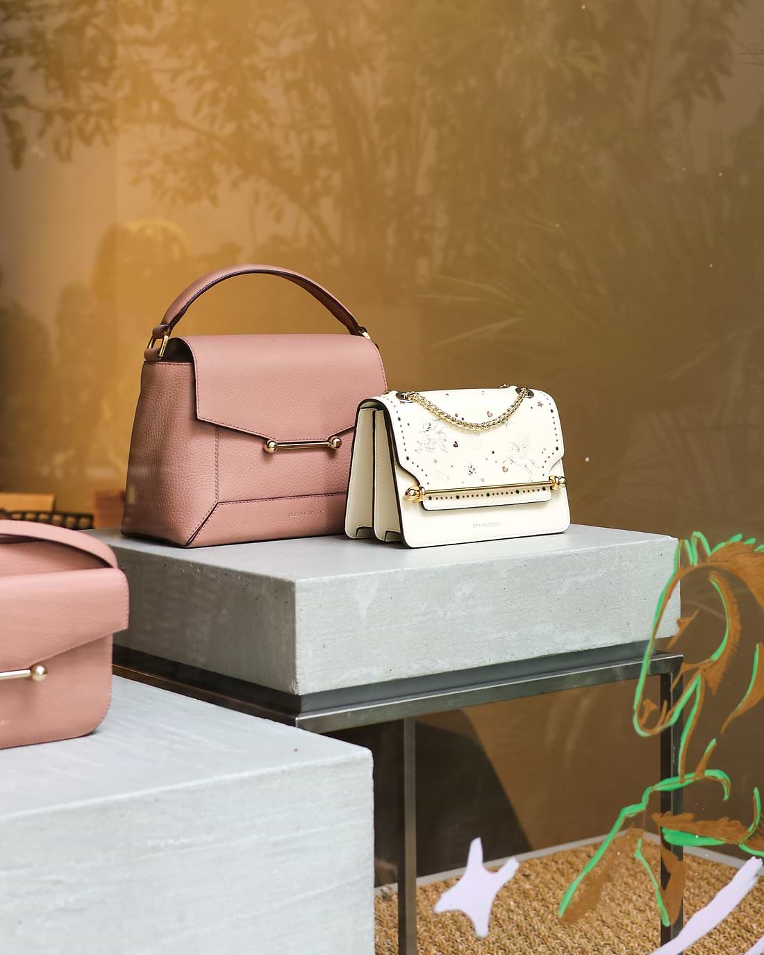 A couple of purses sitting on top of a table