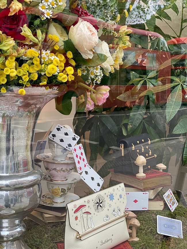 A vase filled with lots of different types of flowers