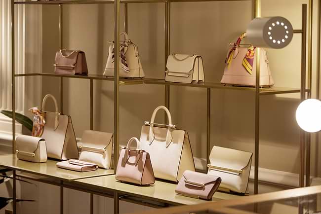 A display of purses and handbags in a store