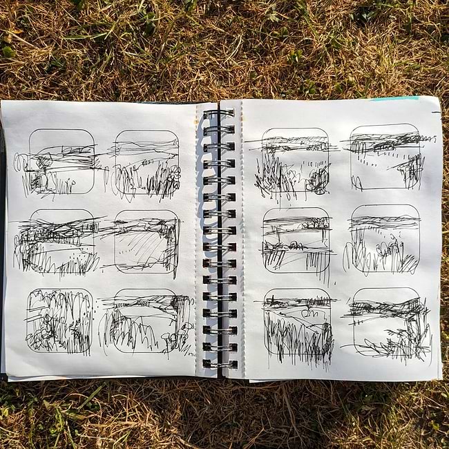 A notebook with a drawing of a landscape
