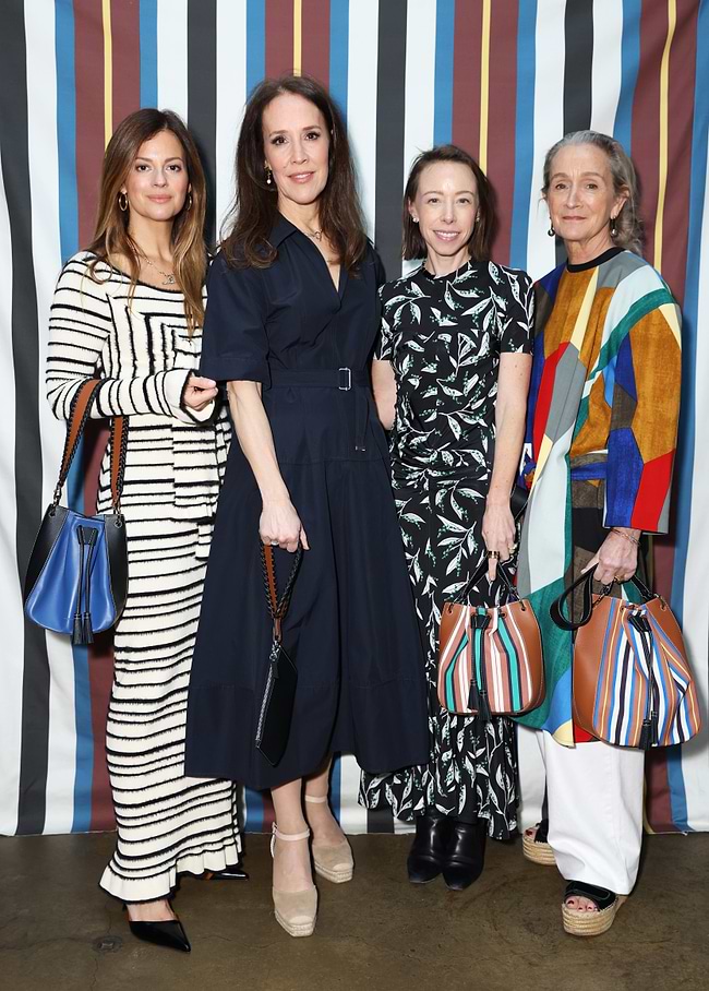 A group of women standing next to each other