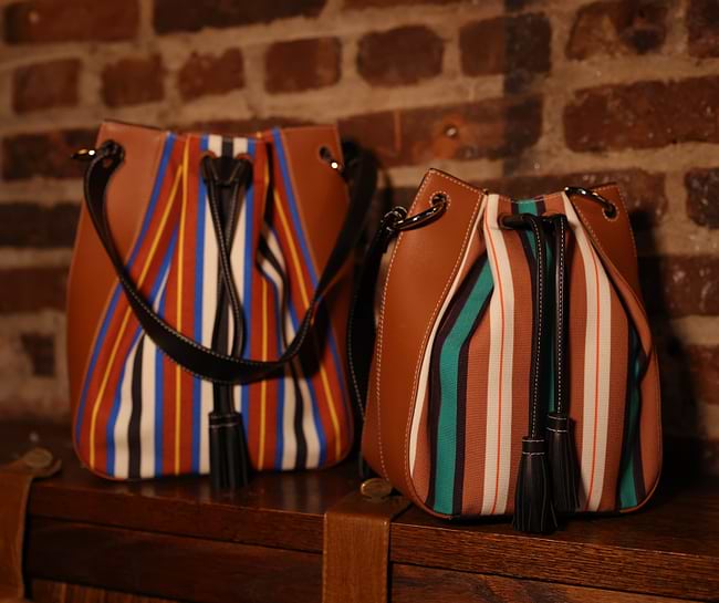 A couple of bags sitting on top of a wooden table
