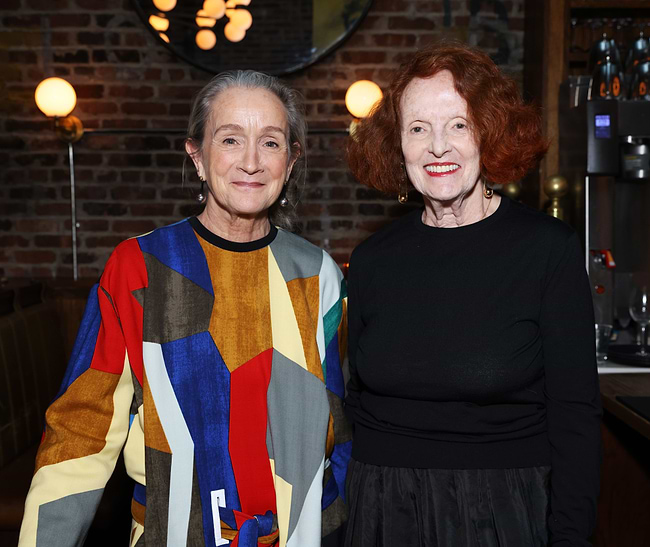 A couple of women standing next to each other