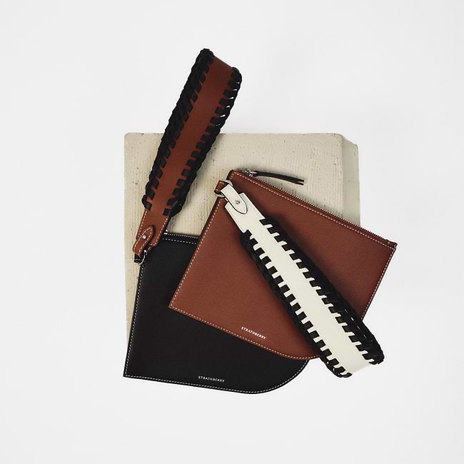 A couple of purses sitting on top of a table