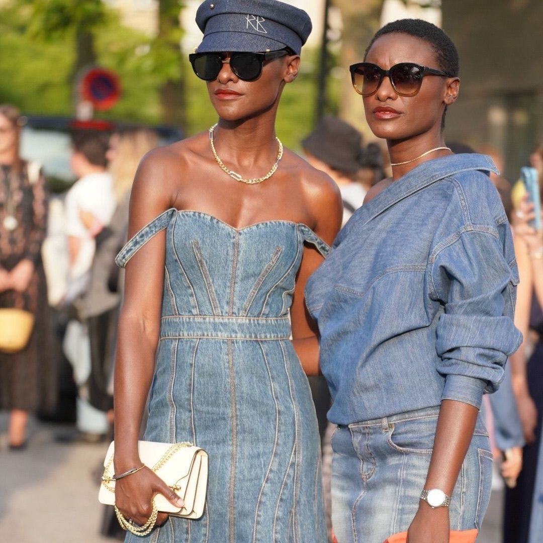 A couple of women standing next to each other
