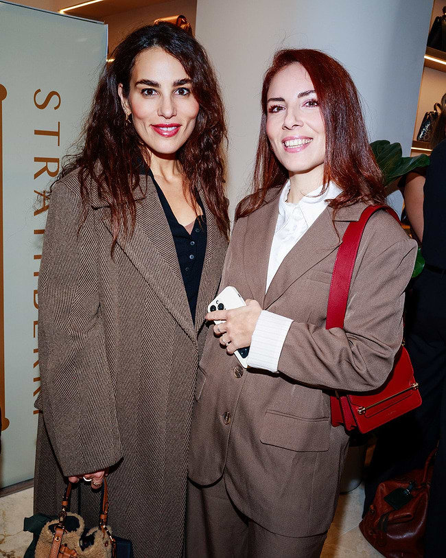 A couple of women standing next to each other