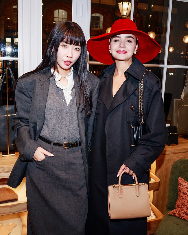 A couple of women standing next to each other