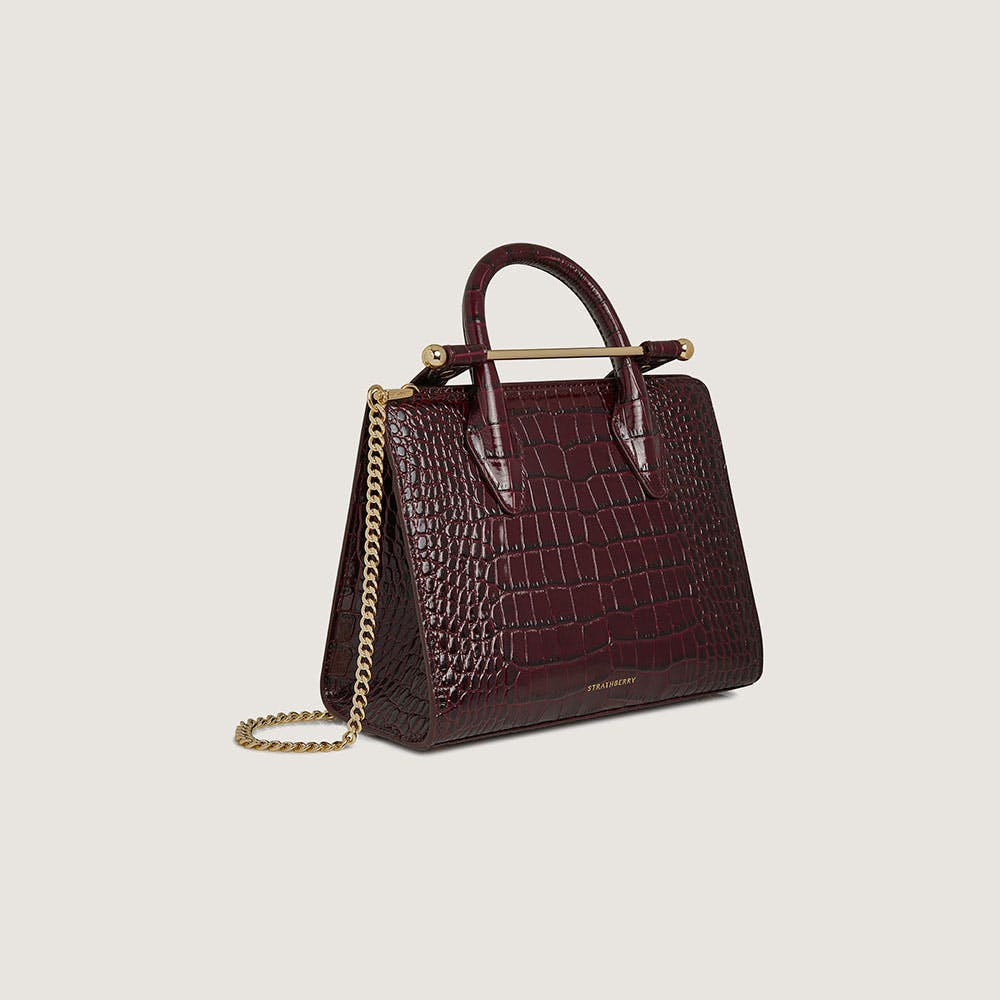 A handbag with a chain hanging from it