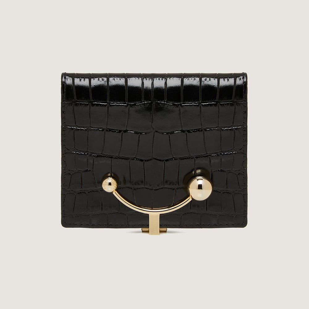 Black croc-embossed crescent wallet with gold curved bar clasp and round studs.