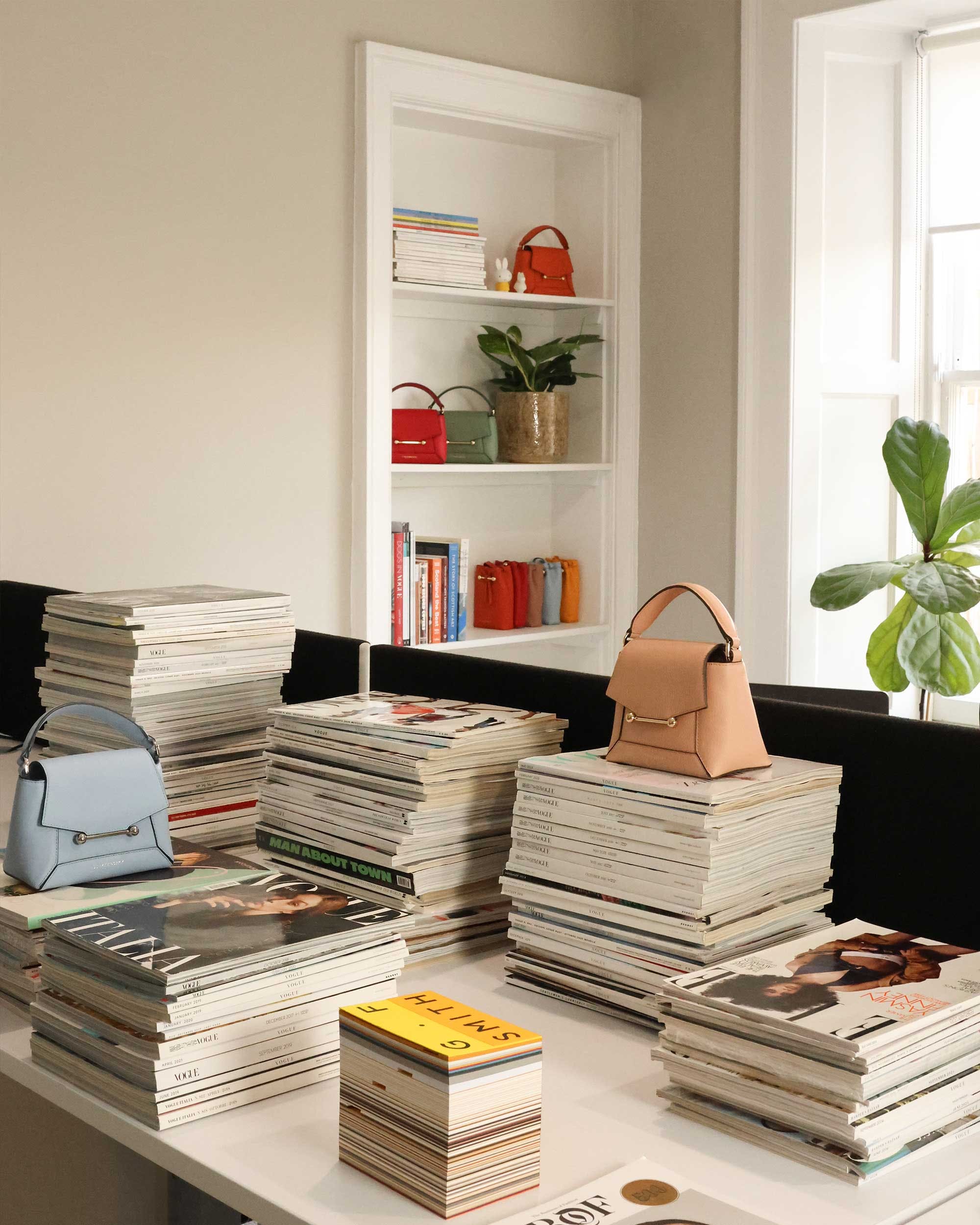 A white table topped with lots of books