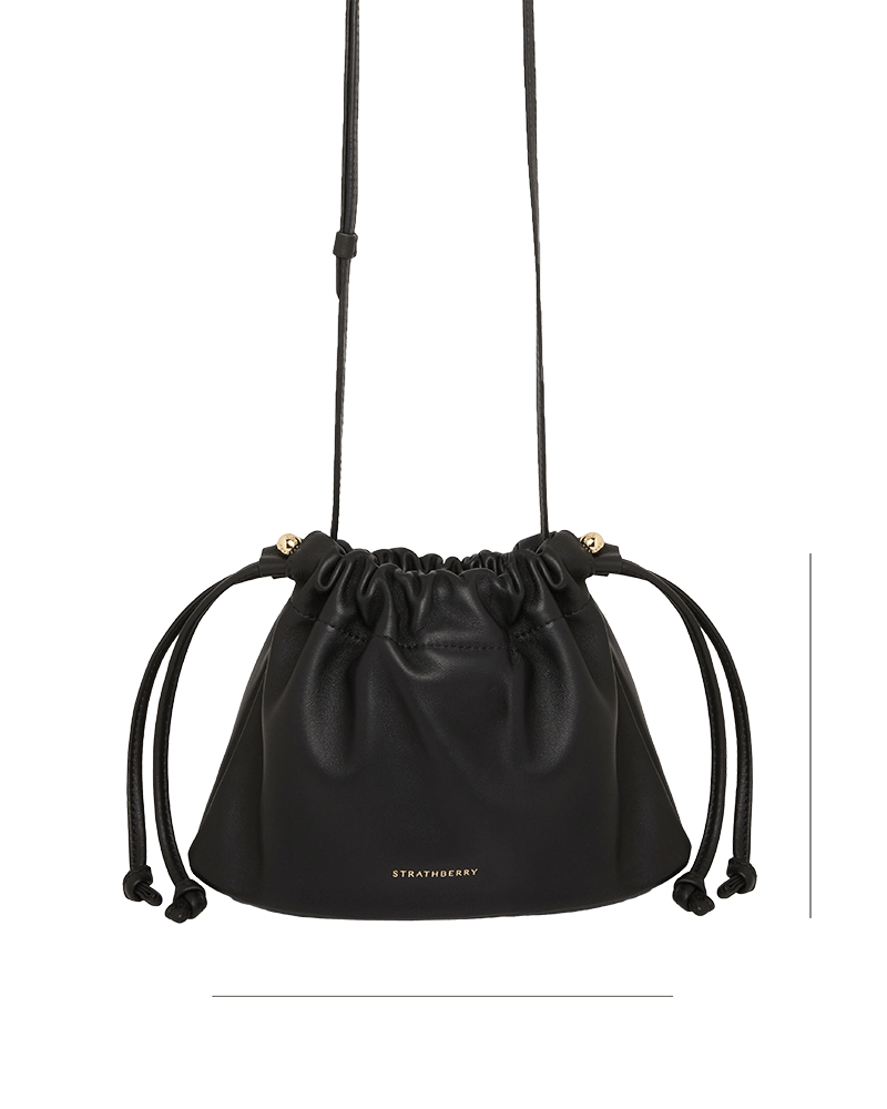 A black leather bag with a drawstring strap