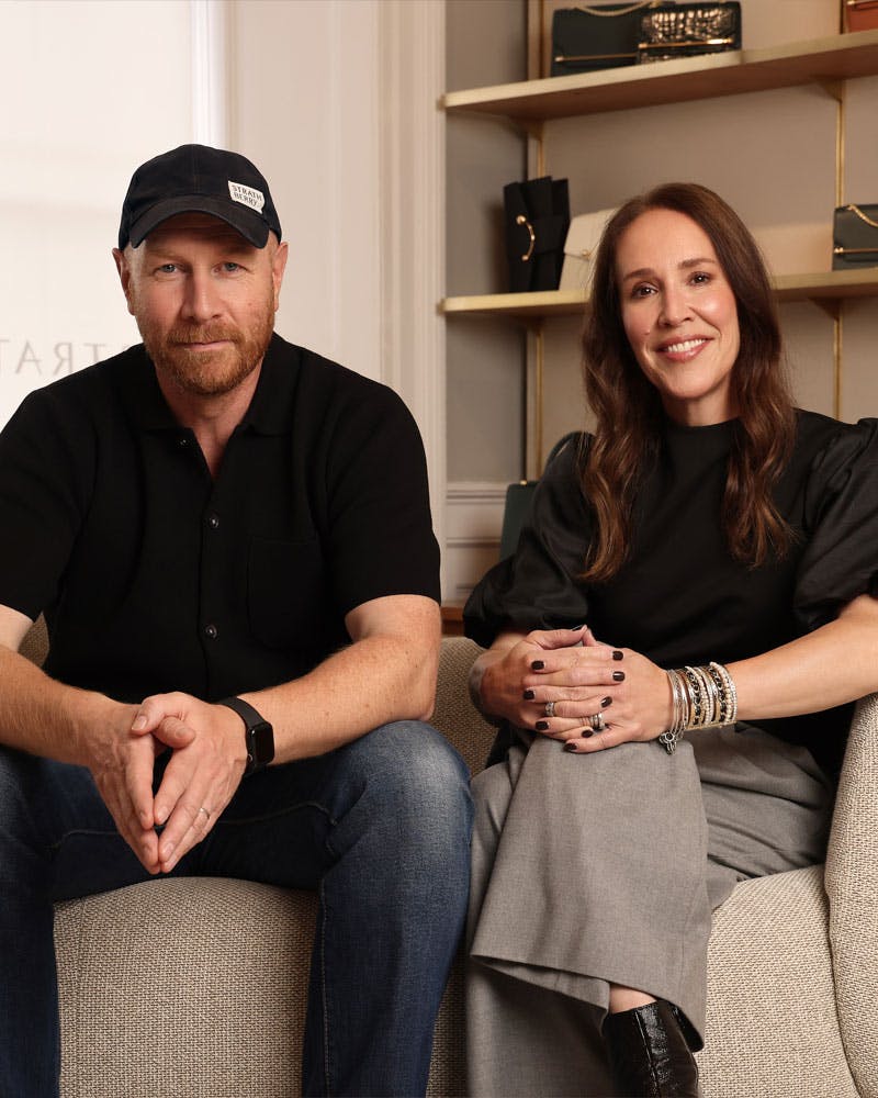 A man and a woman sitting on a couch