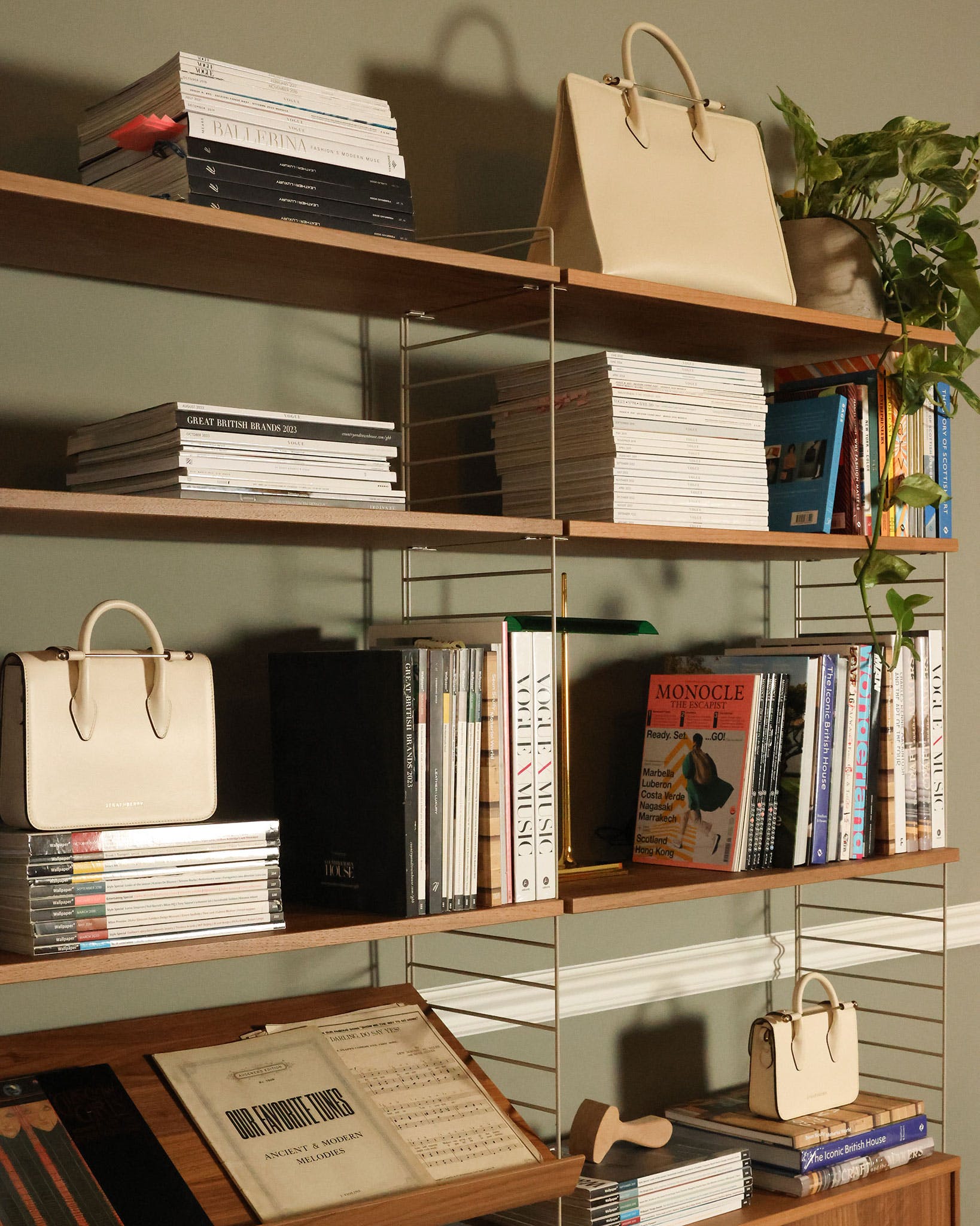 A book shelf filled with books and a bag