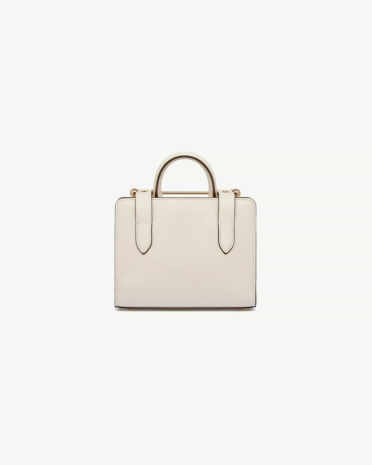Vanilla nano tote with top handles and gold bar fittings.