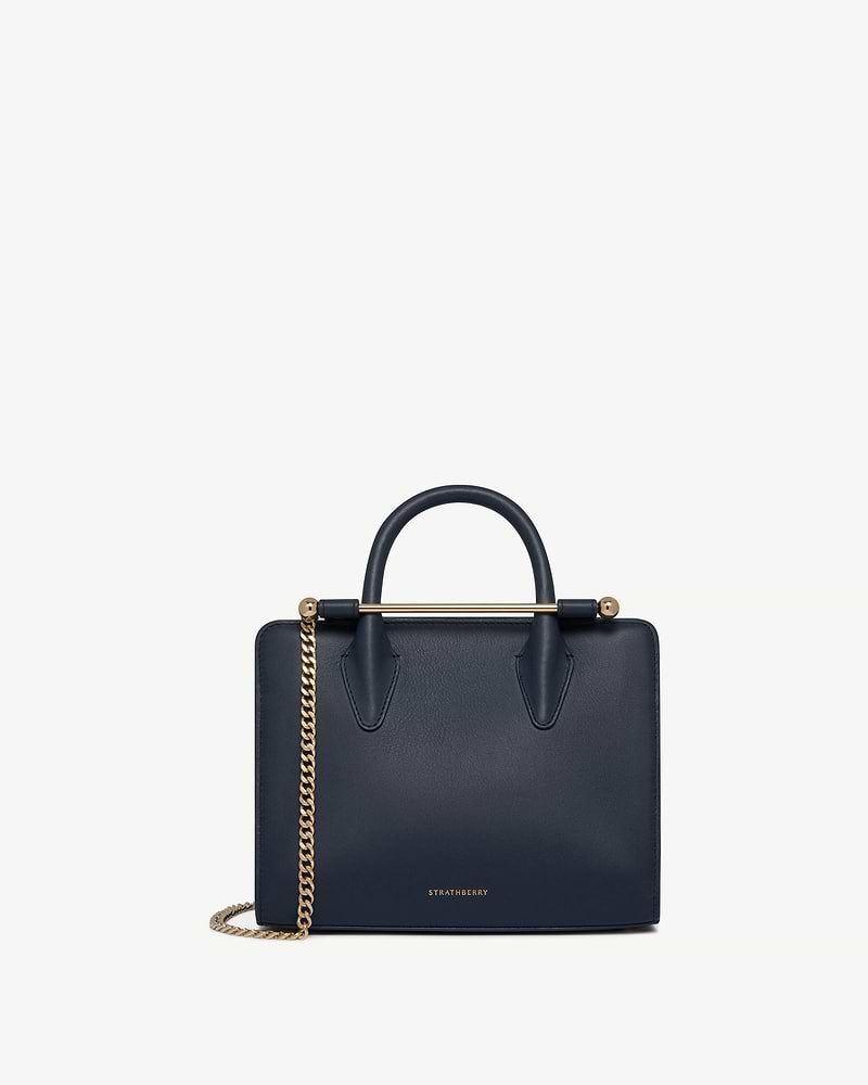 Marine blue Strathberry mini tote with top handle and gold chain strap
