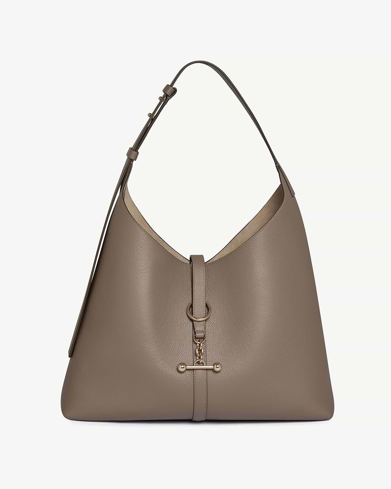 Taupe pebbled leather hobo bag with adjustable shoulder strap and gold ring toggle.