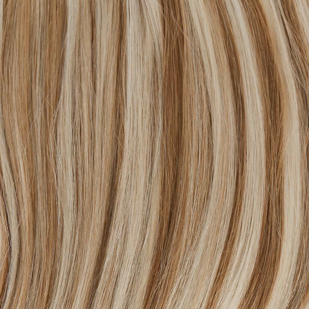 Close-up of light brown and blonde hair extensions strands, showing a smooth, shiny texture with a natural blend of colors.