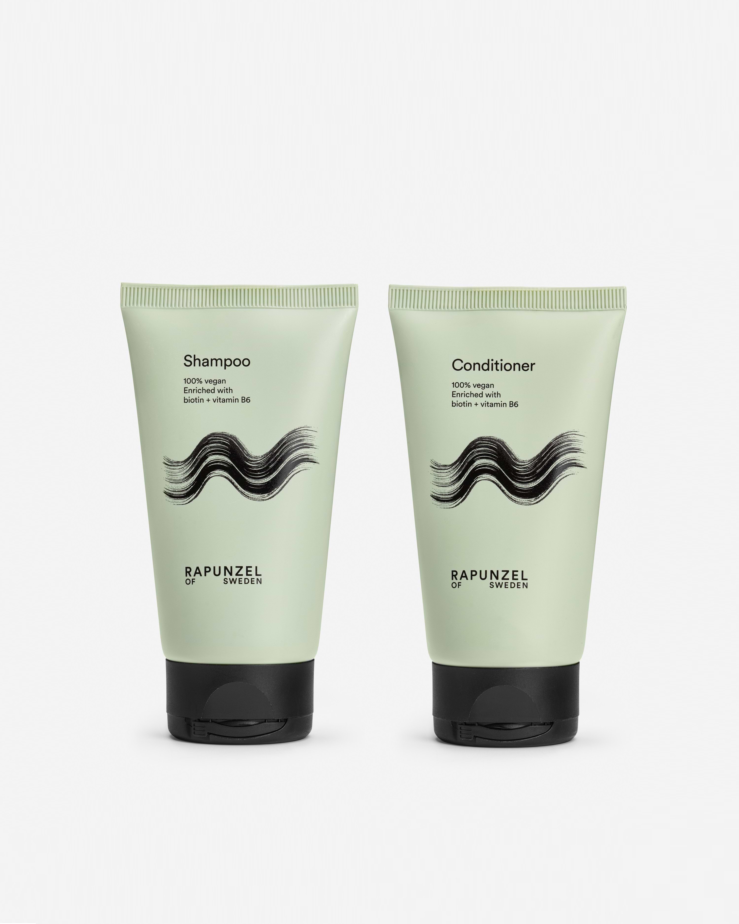 Two green tubes of Rapunzel of Sweden shampoo and conditioner with black caps, labeled with wave graphics on a white background.