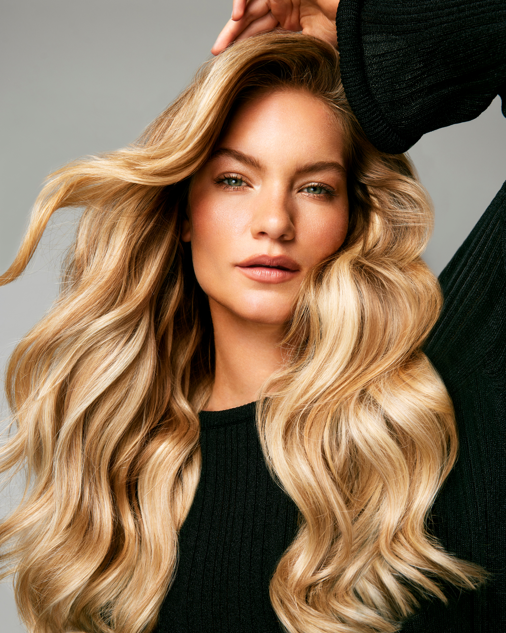 Woman with long blonde hair having voluminous hair