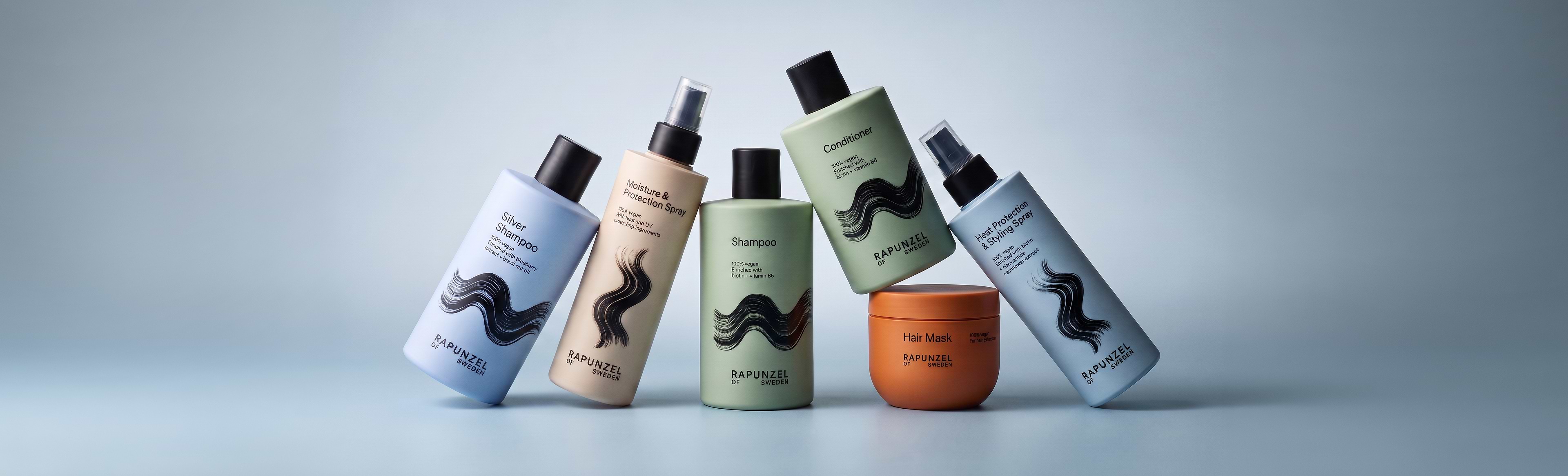 Five hair care products from Rapunzel of Sweden, including shampoos, conditioners, and sprays, are displayed against a light blue background.