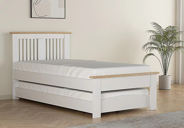 Contemporary oak finish guest bed with pull out under bed. Slatted headboard with a plinth top. Low foot end with a plinth top.