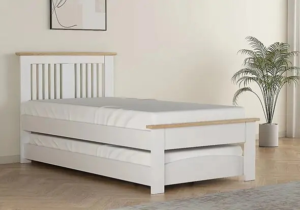 Contemporary oak finish guest bed with pull out under bed. Slatted headboard with a plinth top. Low foot end with a plinth top.