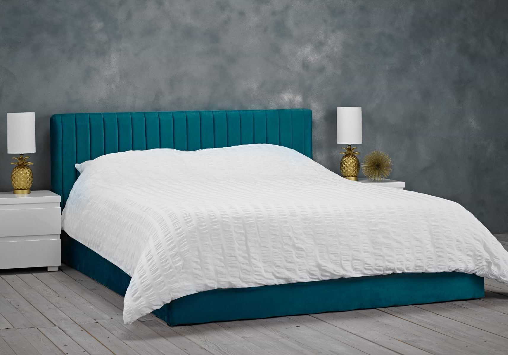 Teal-coloured small double ottoman bed