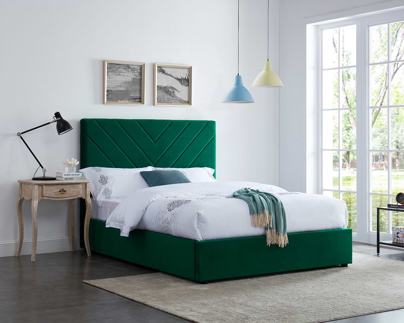 Green bed with white bedsheets