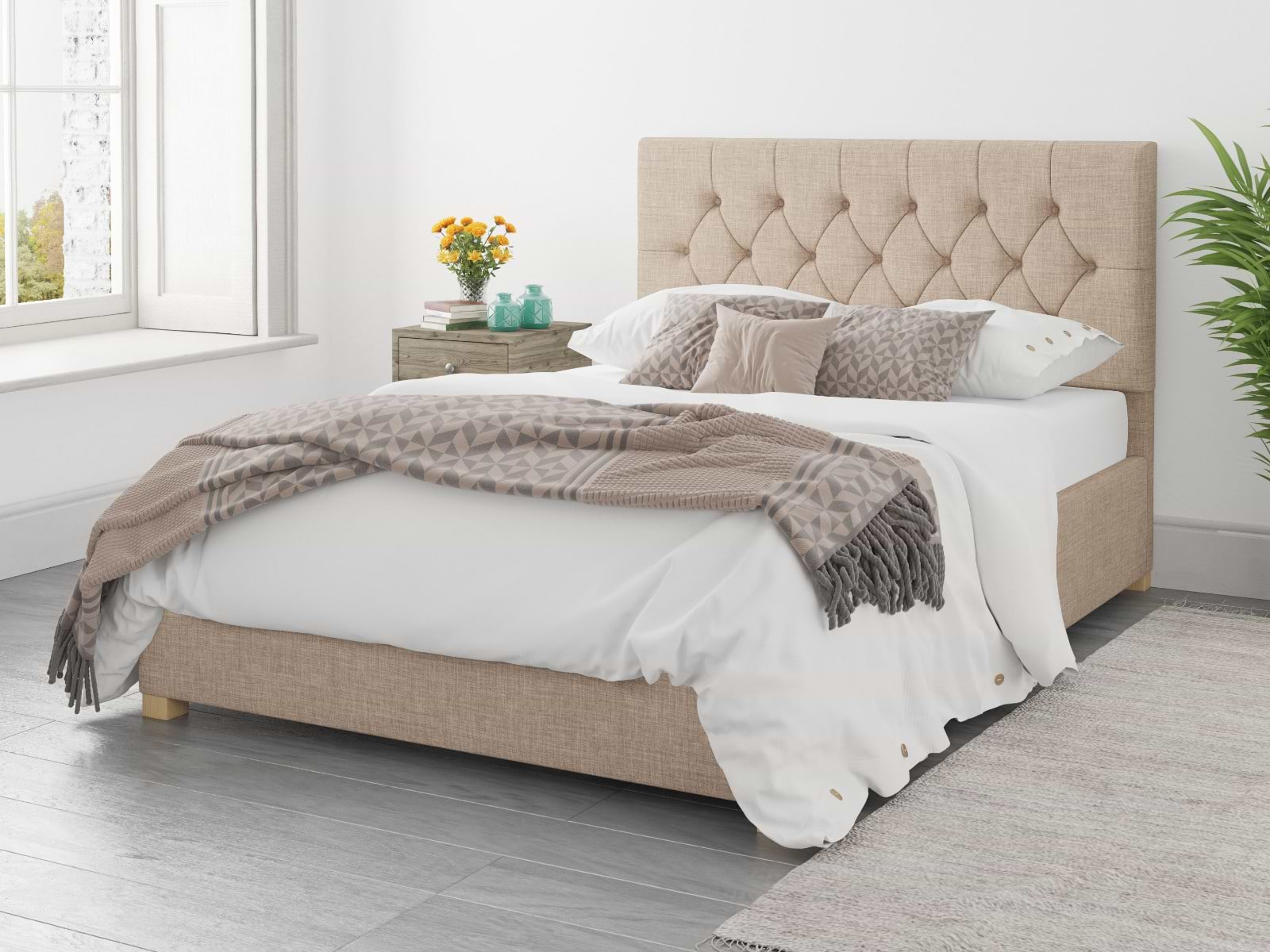 Beige small double ottoman bed with brown and white bedsheets