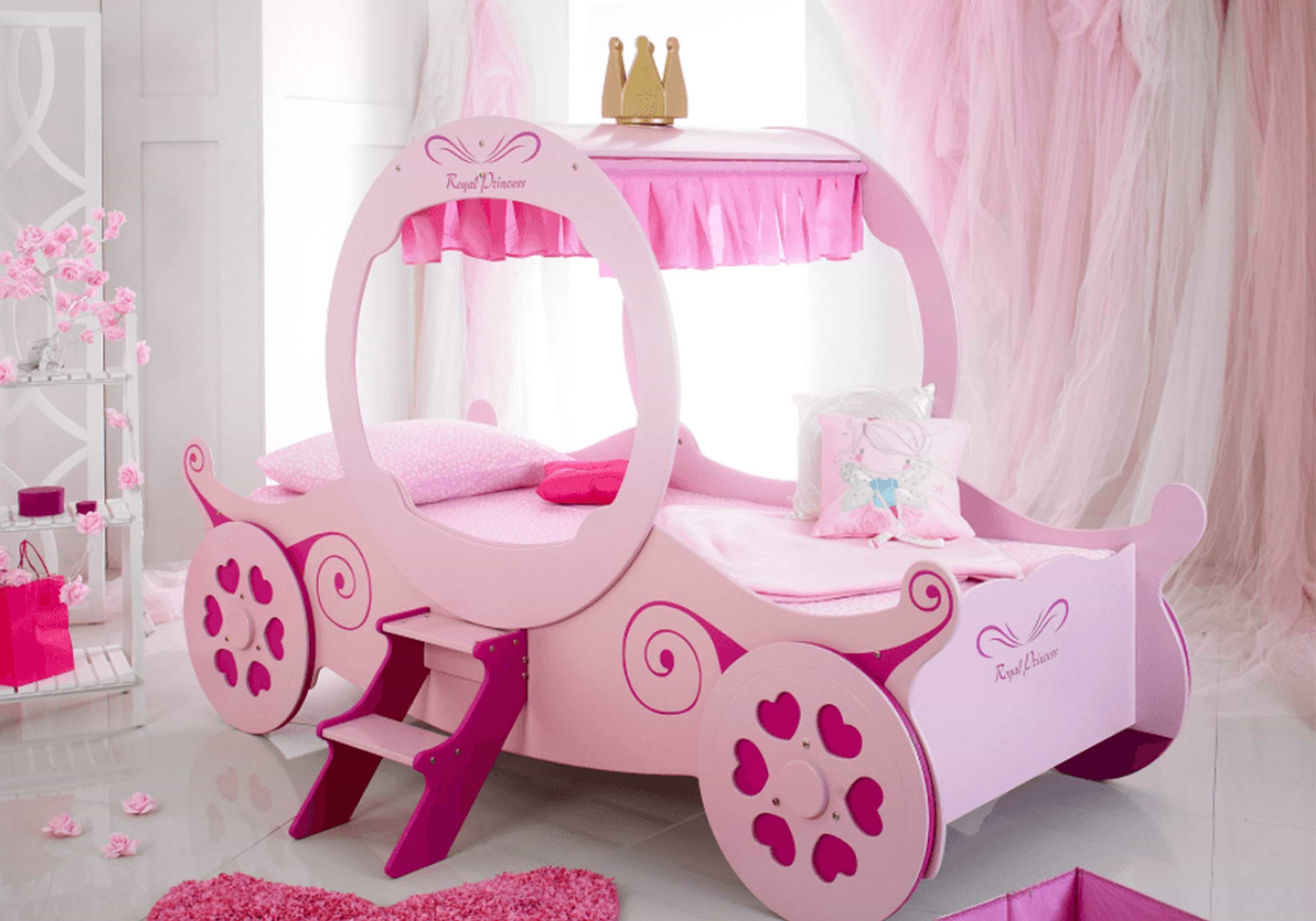 Pink child's bed in the shape of a princess carriage